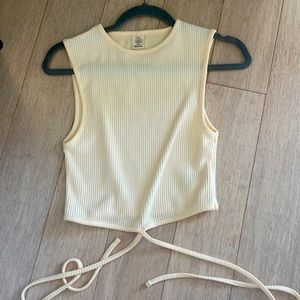 New cream urban outfitters crop top. The ties at the bottom tie around waist